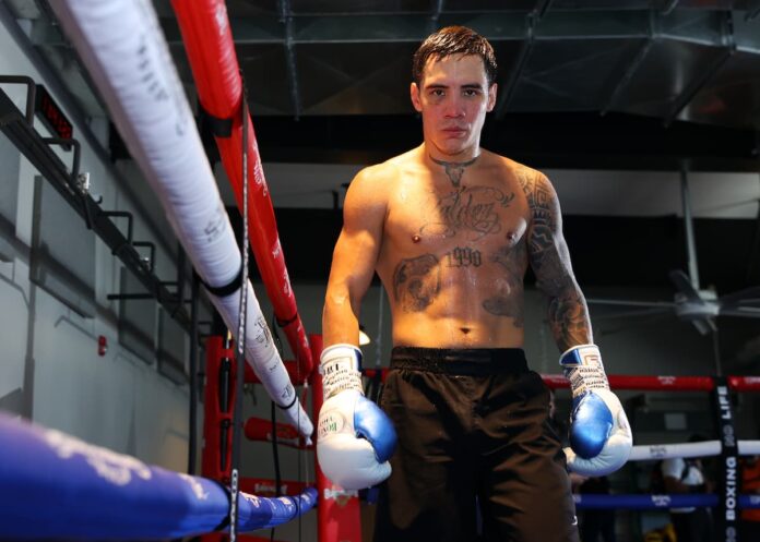 Oscar Valdez poses in the boxing ring during his training camp