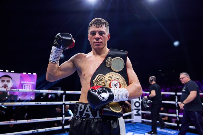 Pat McCormack poses with championship belt after victory against Robbie Davies Jr in Manchester boxing match