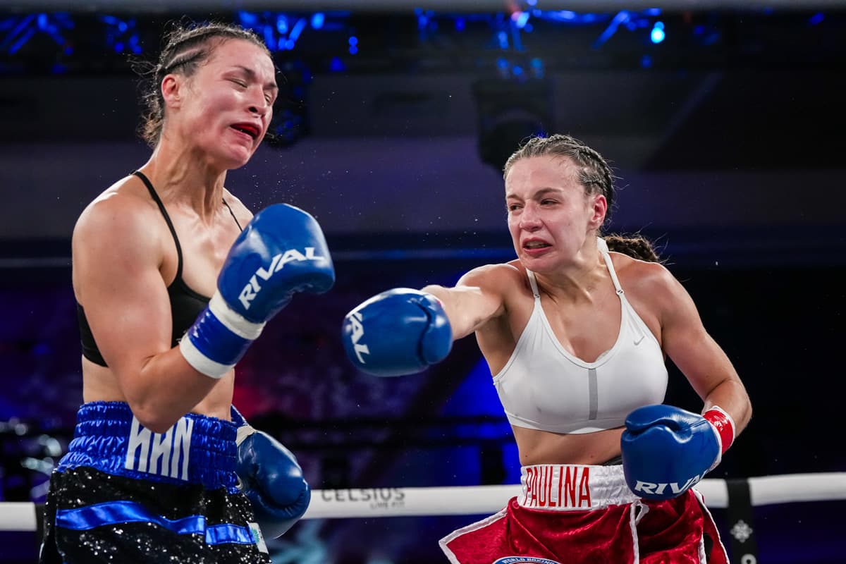 Paulina Angel punches Stephanie Han during their boxing bout at Caribe Royale Orlando