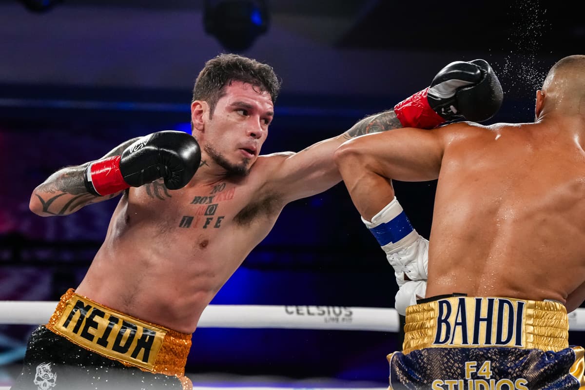 Roger Gutierrez punches Lucas Bahdi during their boxing bout at Caribe Royale Orlando