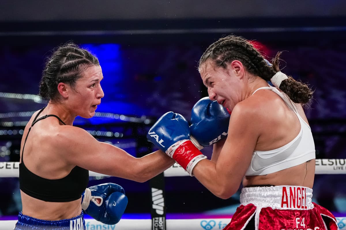 Stephanie Han punches Paulina Angel during their boxing bout at Caribe Royale Orlando