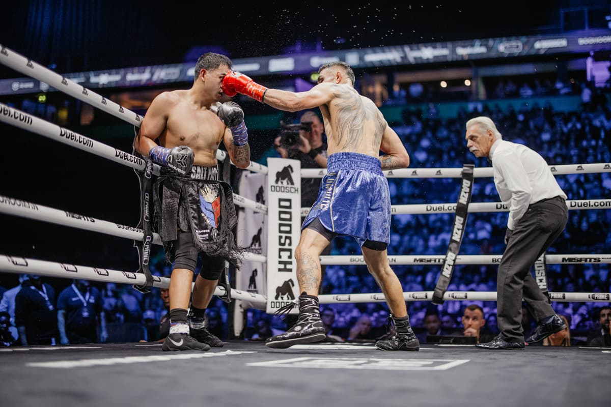 Tony Ferguson throws a jab during his boxing bout against Salt Papi