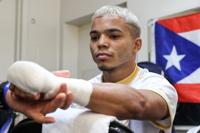 Yankiel Rivera gets his hands wrapped before his boxing bout
