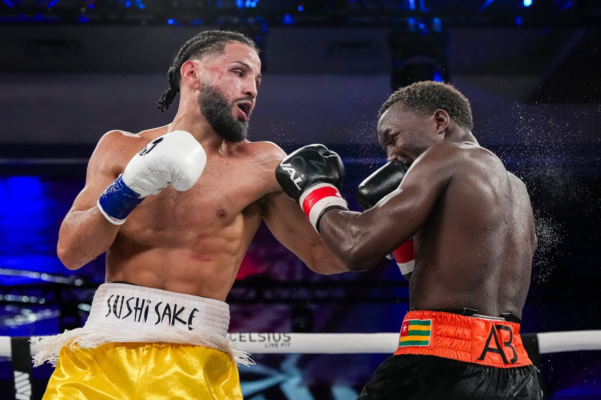 Yoenis Tellez punches Abass Baraou during their boxing bout at Caribe Royale Orlando