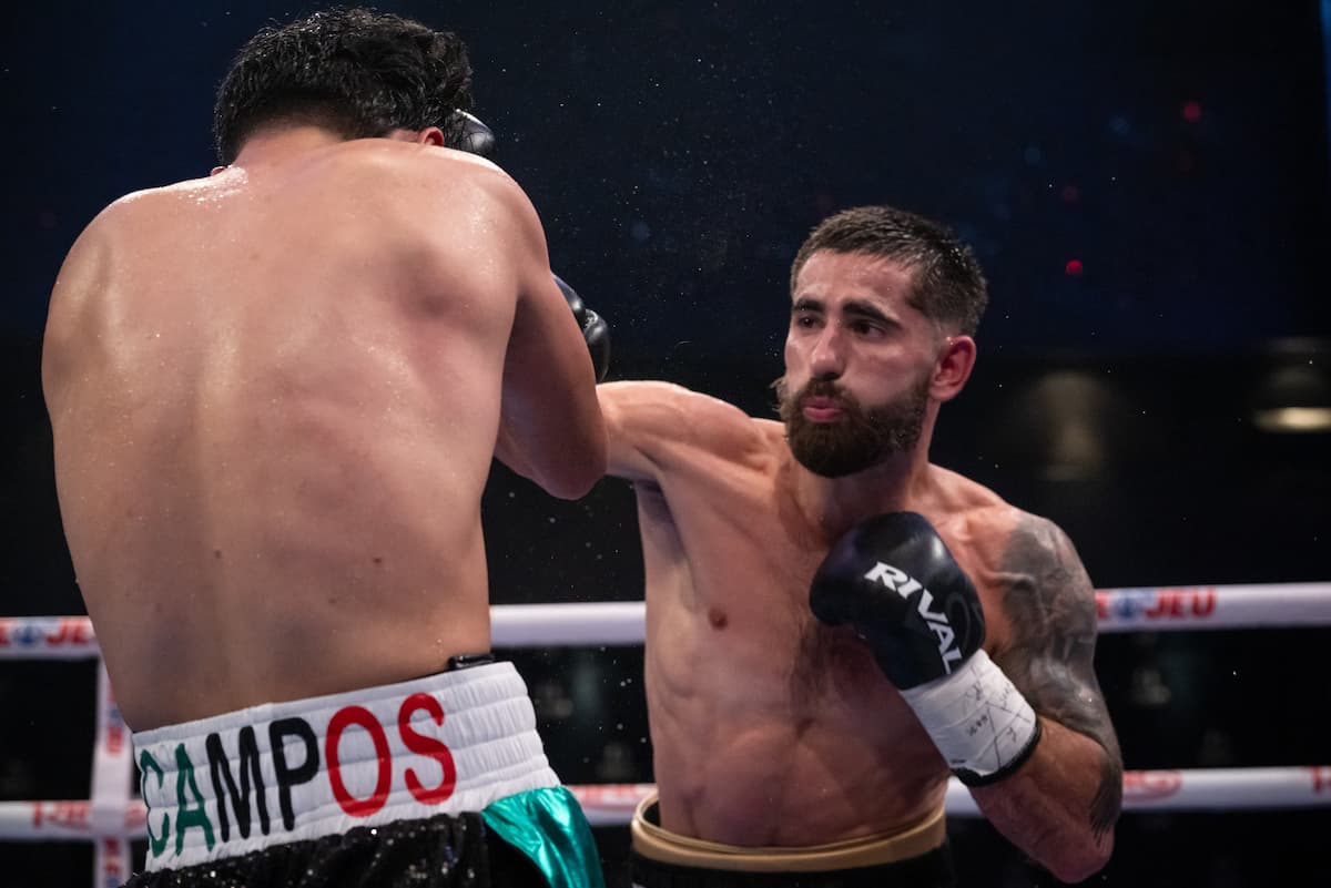 Avery Martin Duval punches Luis Campos Cortez during their boxing bout
