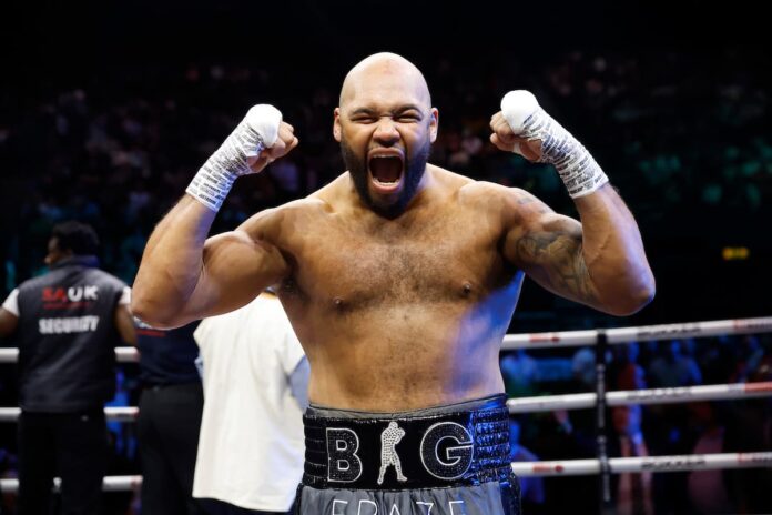 Frazer Clarke celebrating his victory over Ebenezer Tetteh in a boxing match