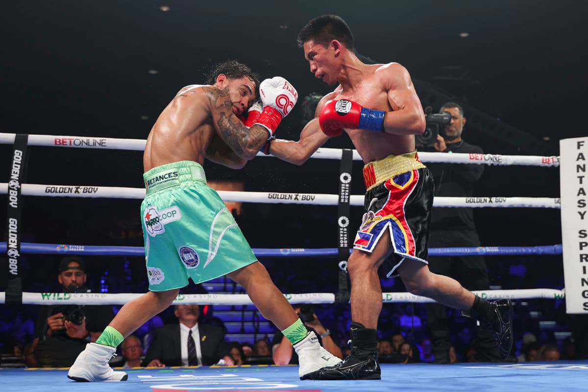 Jayson Vayson throws an uppercut during his bout against Oscar Collazo