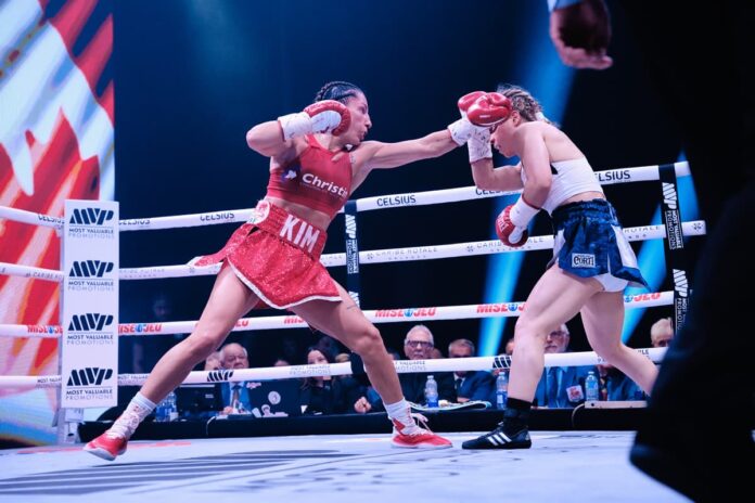 Kim Clavel throws a jab during her bout against Sol Cudos