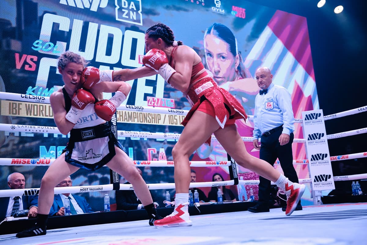 Kim Clavel punches Sol Cudos during their bout