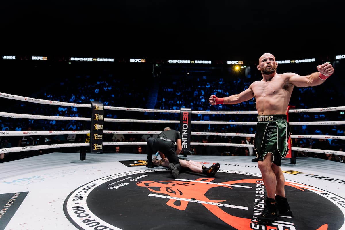Lewis Garside knocks down Jonno Chipchase during their bout