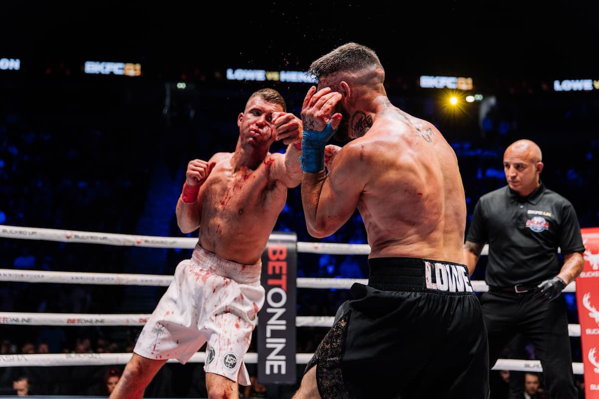 Mikey Henderson throws a punch during his bout against Benjamin Lowe