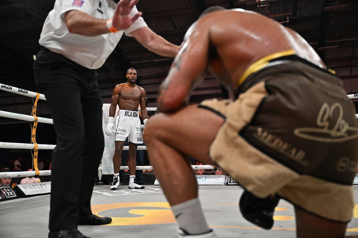 Shakiel Thompson knocks down Grant Dennis during their bout