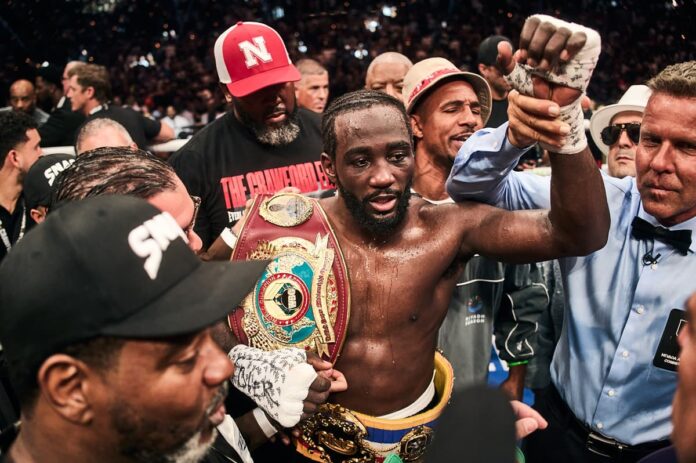 Referee raises Terence Crawford's hand in victory over Canelo Alvarez during their boxing bout