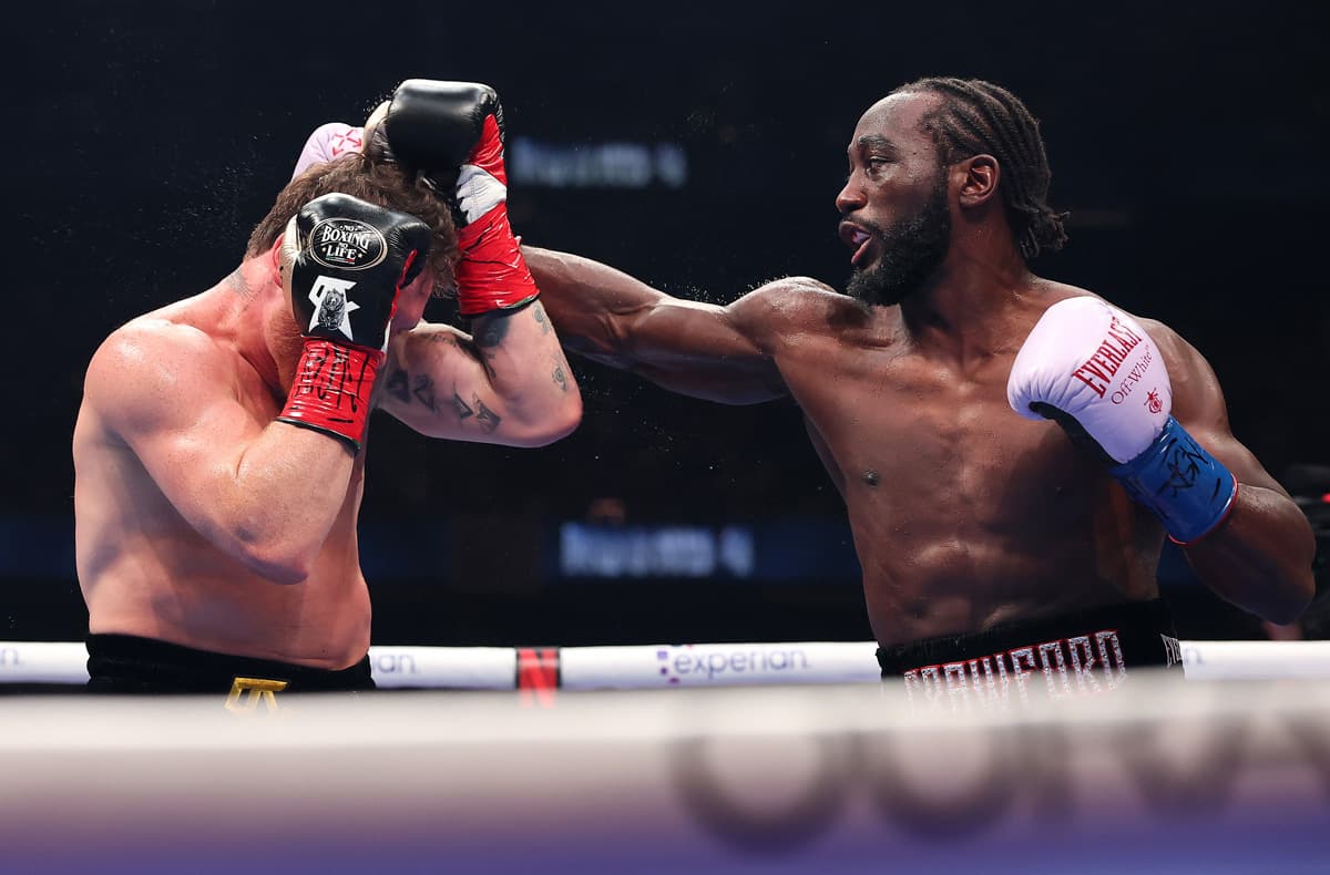 Terence Crawford punches Canelo Alvarez during their boxing bout