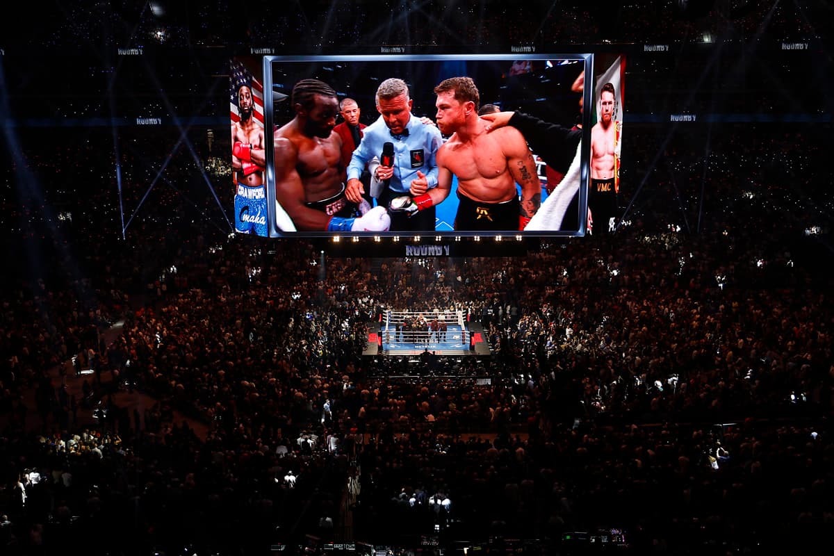 Screen displaying Terence Crawford vs Canelo Alvarez during their boxing bout at Allegiant Stadium
