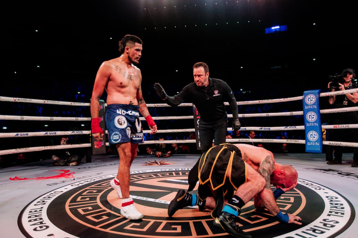 Carlos Trinidad knocks down Jimmy Sweeney during their bout