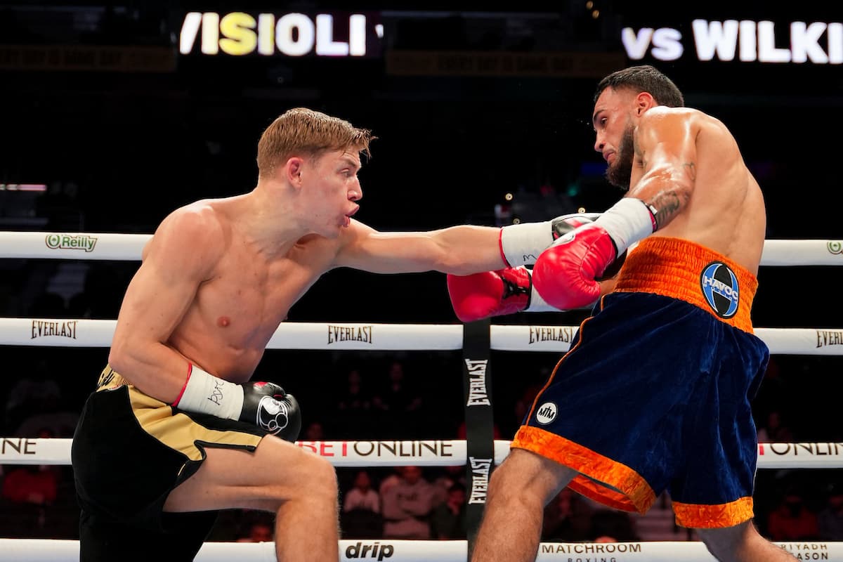 Giorgio Visioli punches James Wilkins during their boxing bout