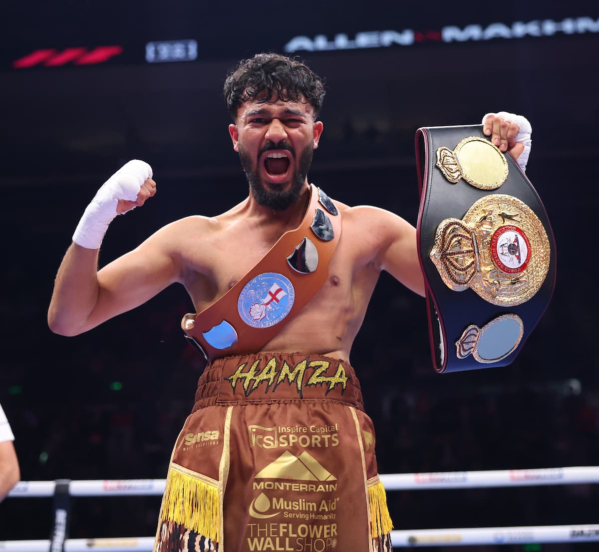 Hamza Uddin poses with his championship belts