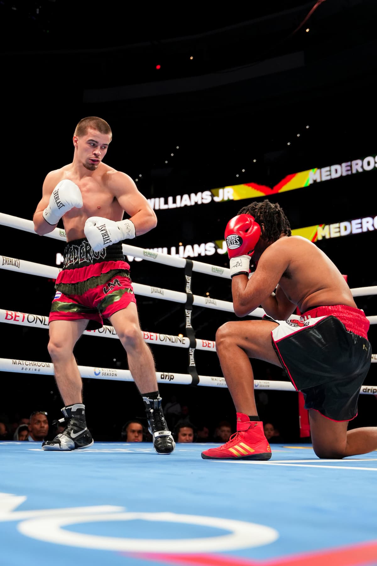 Harley Mederos knocks down Hylon Williams Jr during their bout