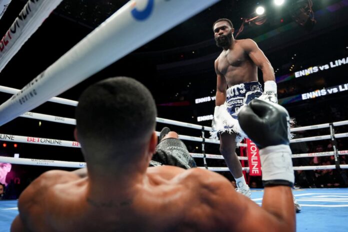 Jaron Ennis knocks down Uisma Lima during their boxing bout