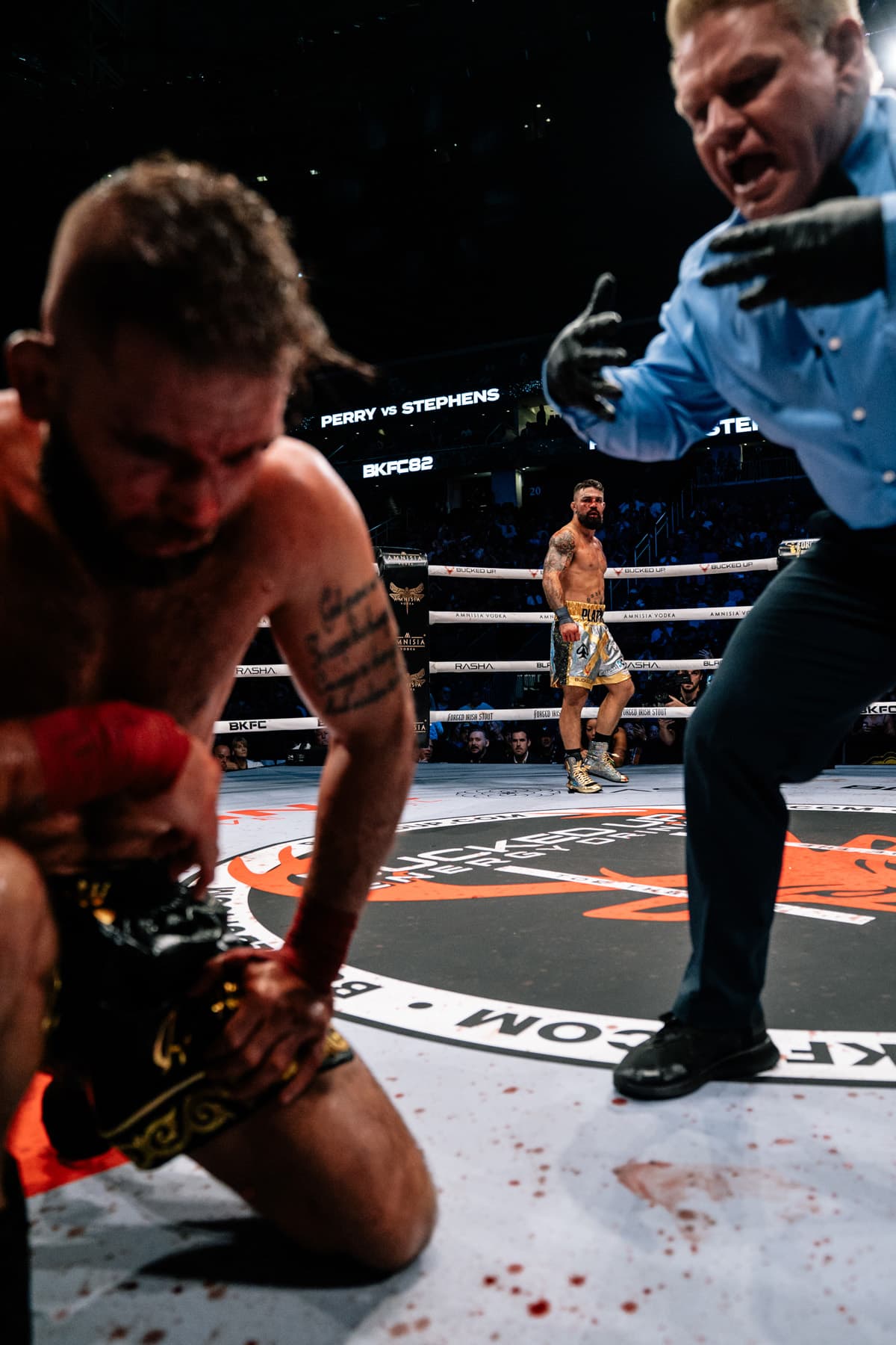 Jeremy Stephens suffers a knockdown during his bout against Mike Perry