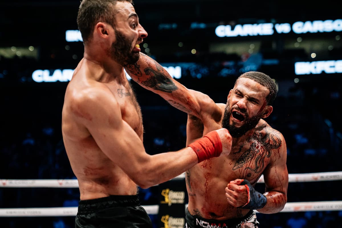 Justin Clarke punches Ishiah Carson