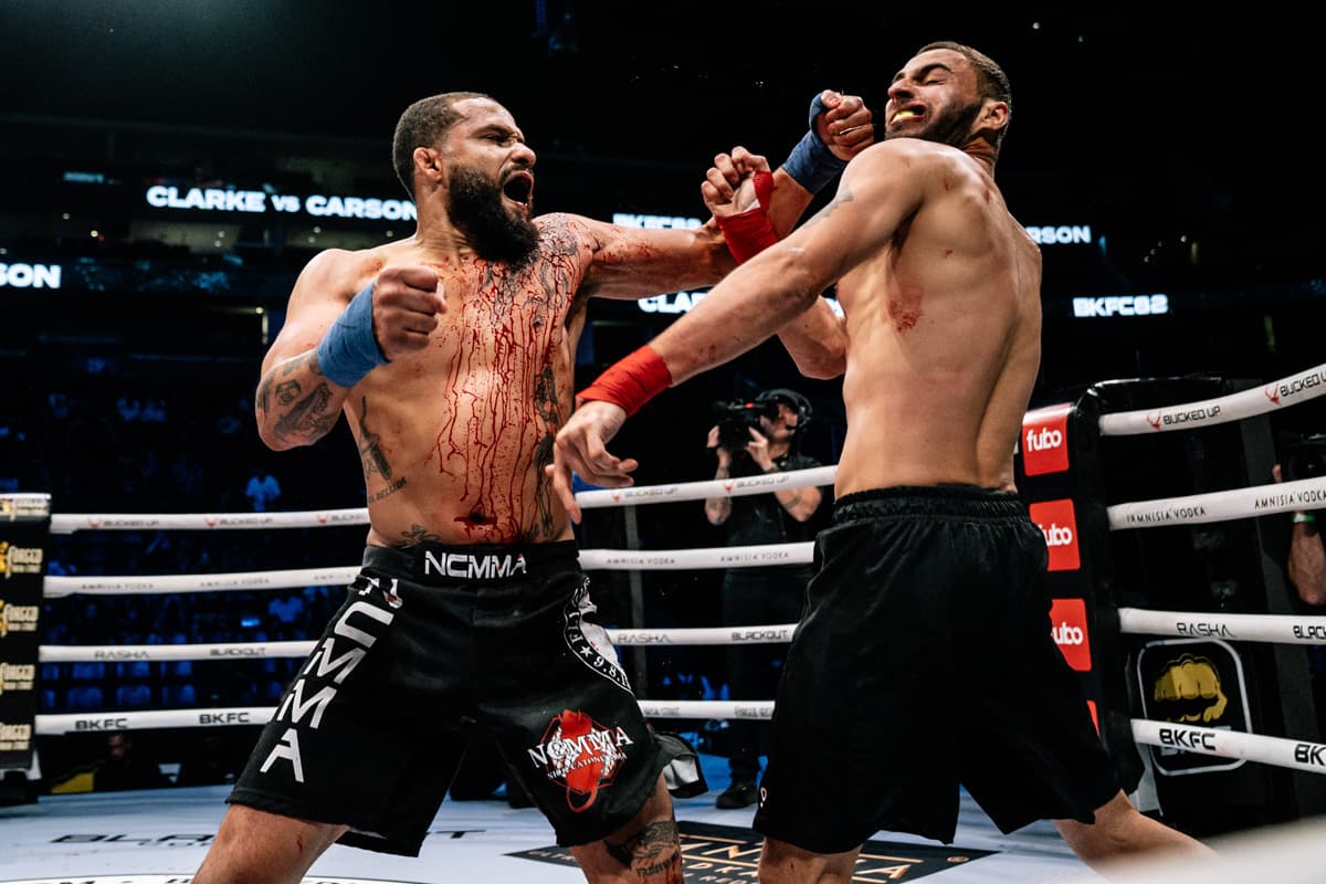 Justin Clarke punches Ishiah Carson