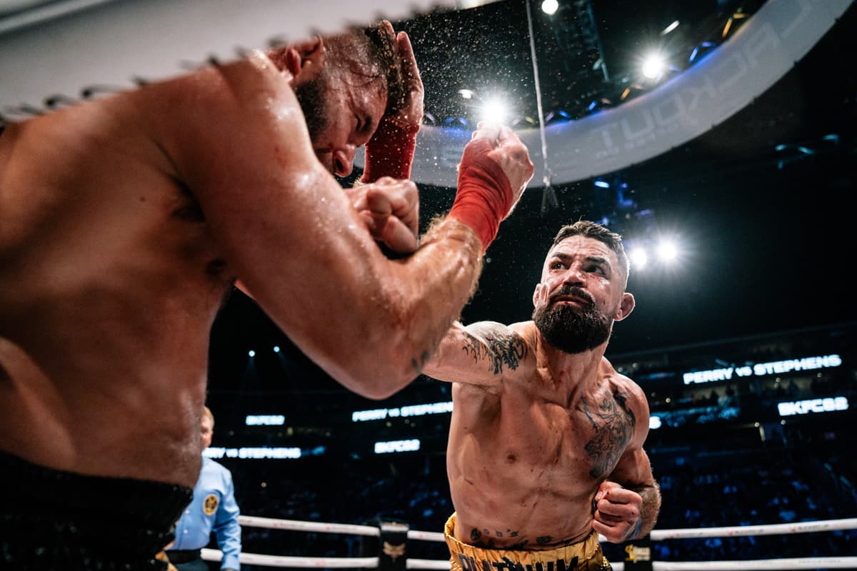 Mike Perry punches Jeremy Stephens during their bout