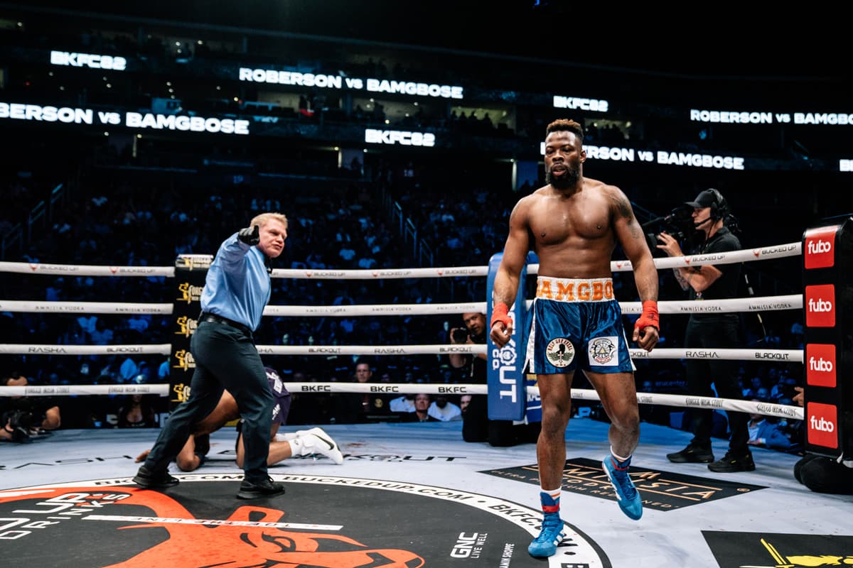 Oluwale Bamgbose knocks down Karl Roberson during their bout