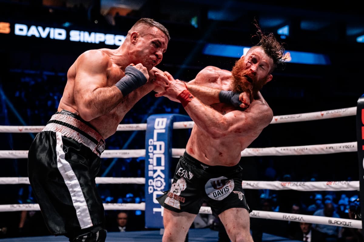 Cody Vidal punches David Simpson during their bout