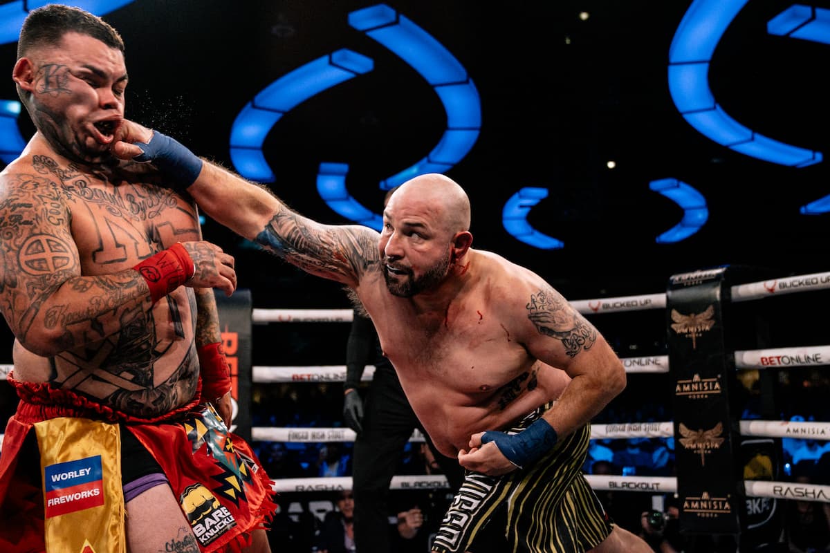 Erick Lozano punches Tylor Sijohn during their bout