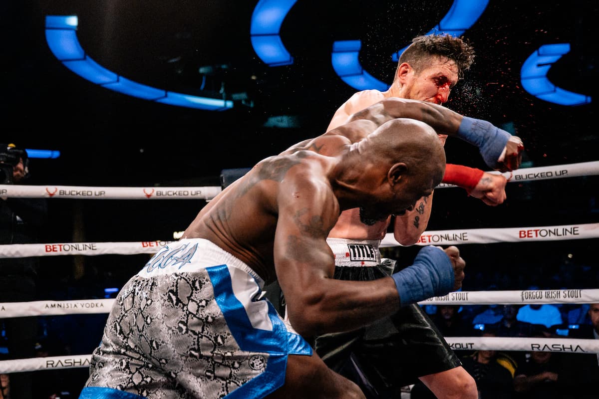 Joseph Creer punches Taylor Bull during their bout