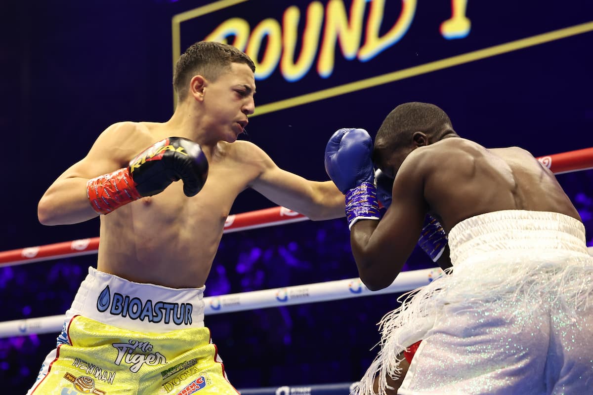Juan Perez punches Barker Ssewanyana during their bout