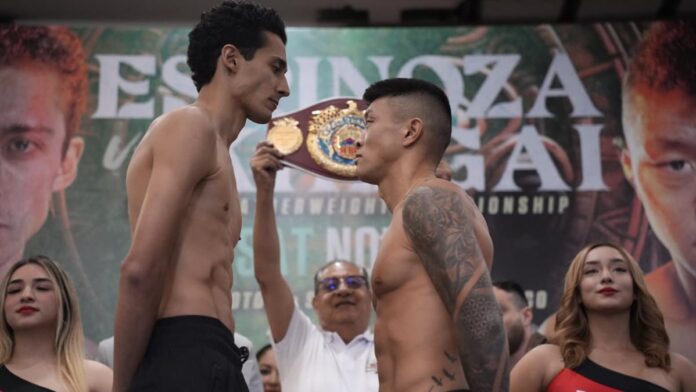 Rafael Espinoza and Arnold Khegai face off at the weigh-in, ahead of their bout in San Luis Potosi, Mexico