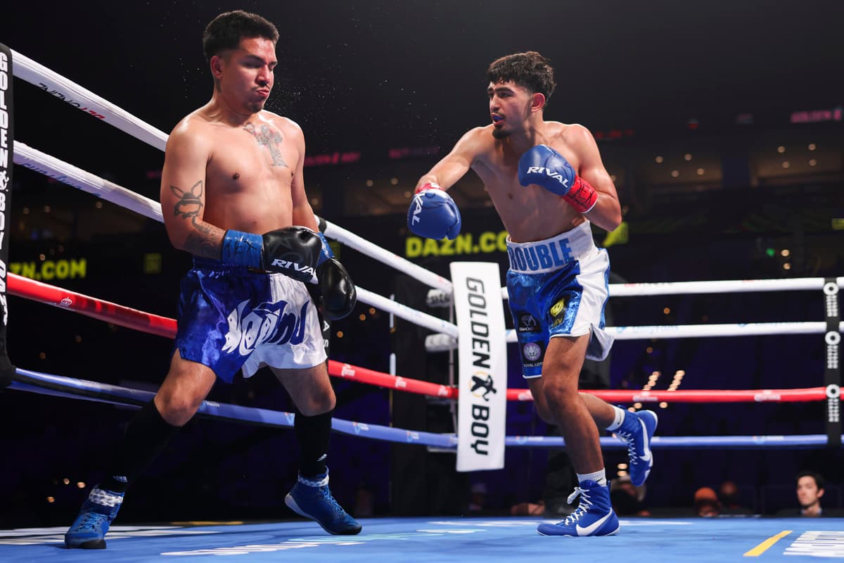 Samuel Castellanos throws a punch during his bout against Ricardo Elizalde
