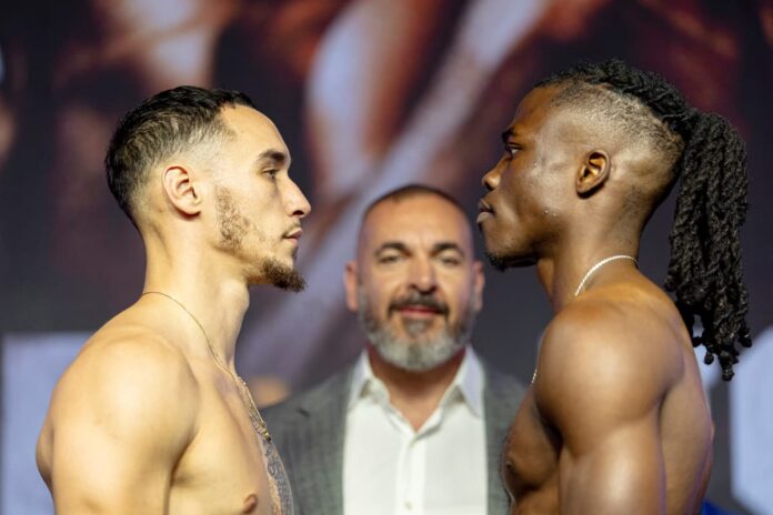 Steven Butler and Stephane Fondjo face off at the weigh-in, ahead of their boxing bout in Montreal, Canada