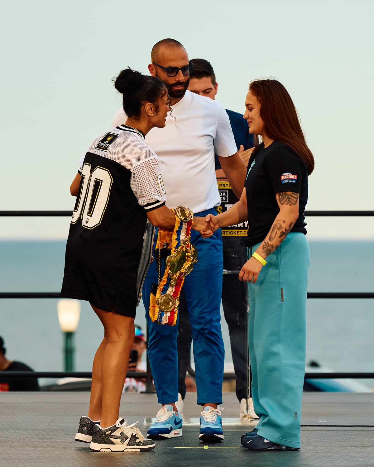 Amanda Serrano and Reina Tellez shake hands