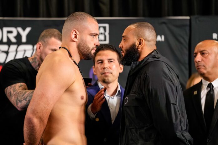 Antonio Plazibat and Nordine Mahieddine face off at the weigh-in ahead of their kickboxing bout at Glory Collision 8