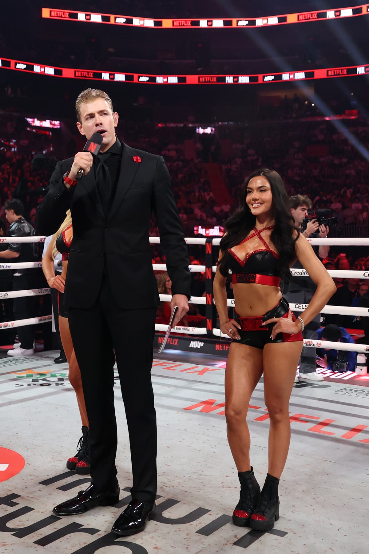 Announcer Kody Mommaerts aka 'Big Mo' and ring girl Raphaela Milagres