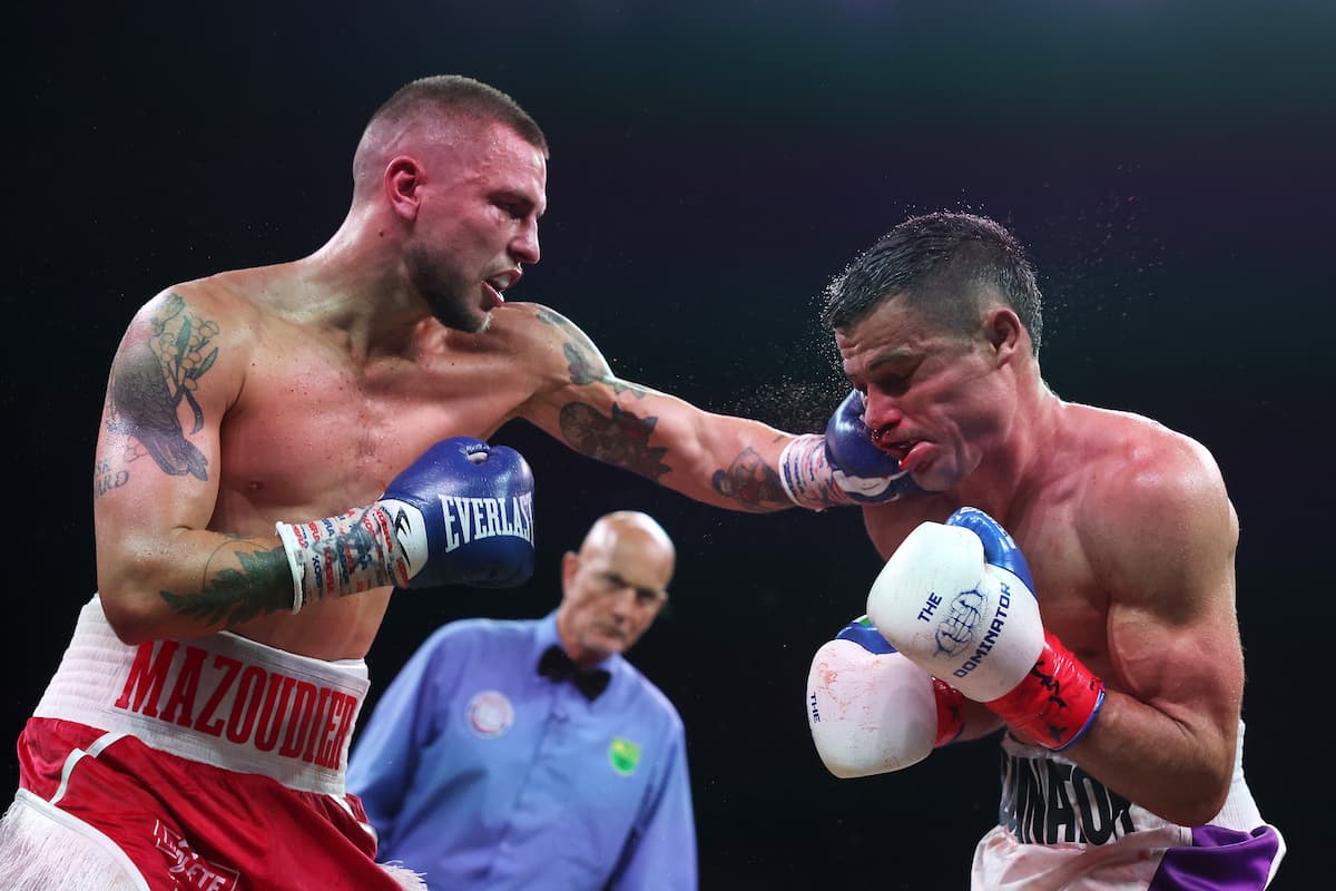 Koen Mazoudier punches Dominic Molinaro during their bout