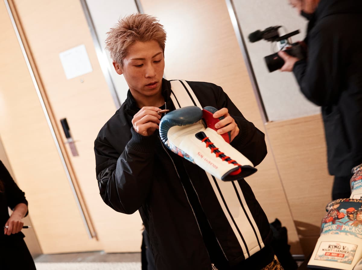 Naoya Inoue signs boxing gloves