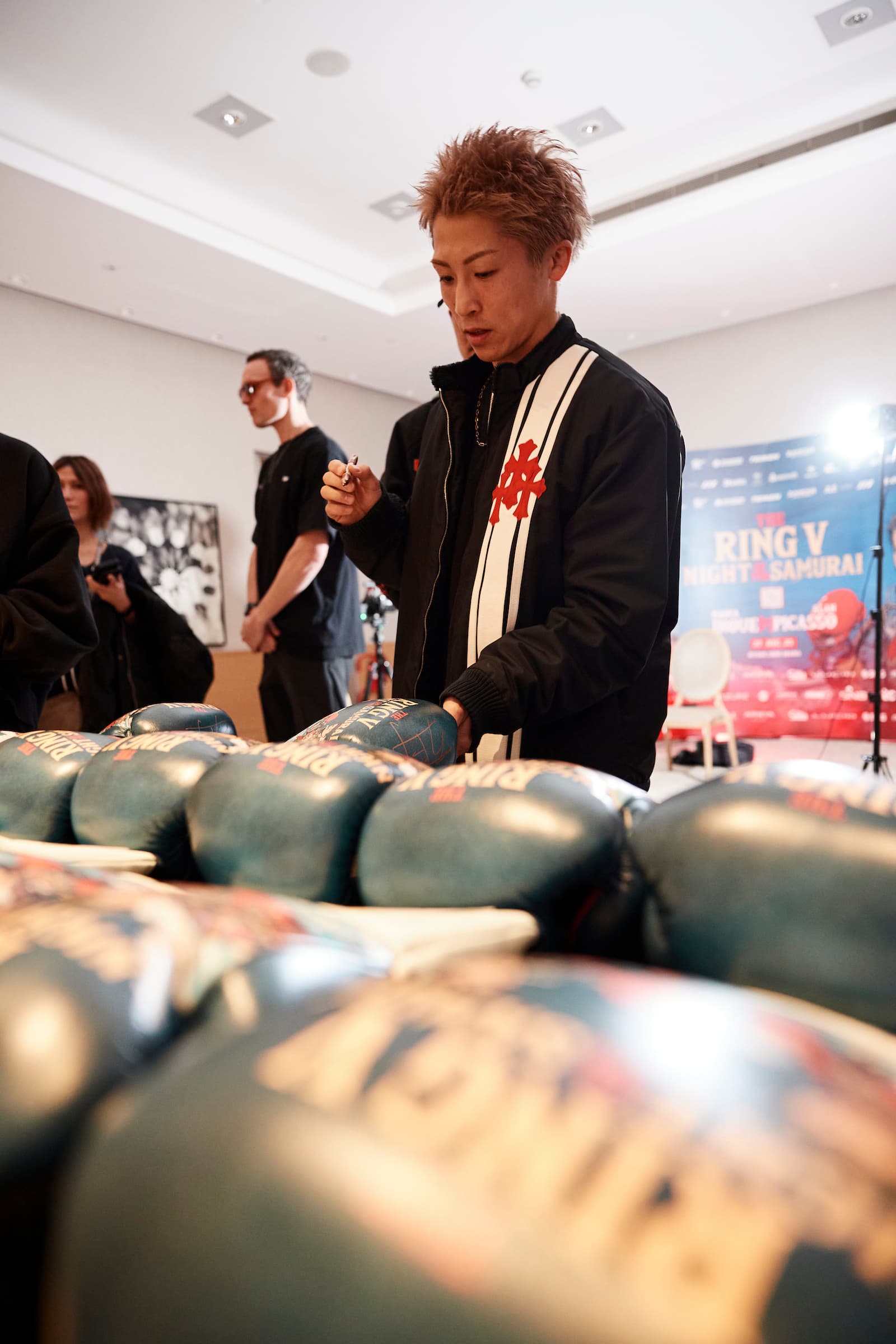 Naoya Inoue signs boxing gloves