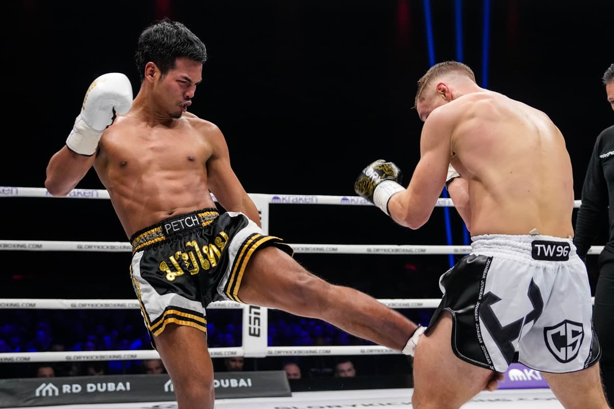 Petch throws a leg kick during his bout against Denis Wosik