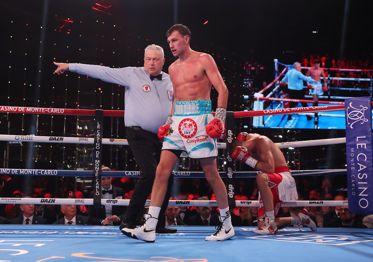 Sean McComb knocks down Hugo Micallef during their boxing bout