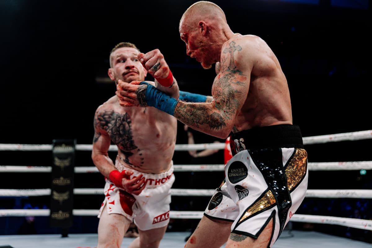 Tommy Hawthorn throws a punch during his bout against Tommy Carus