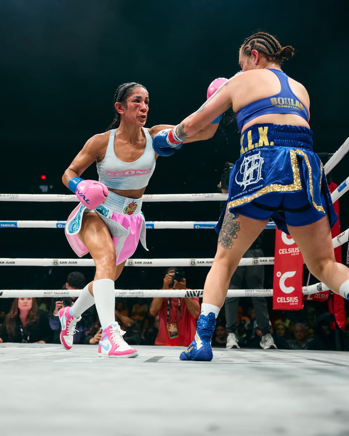Amanda Serrano throws a punch during her bout against Reina Tellez