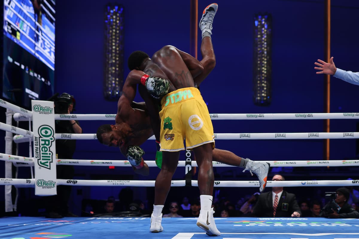 Khalil Coe lifts and slams Jesse Hart in the ring during their bout