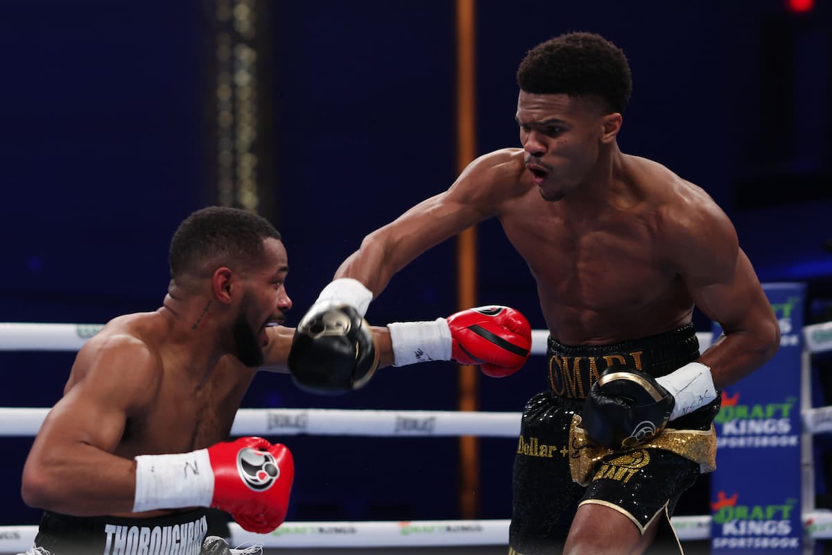 Omari Jones throws a punch during his bout against Jerome Baxter
