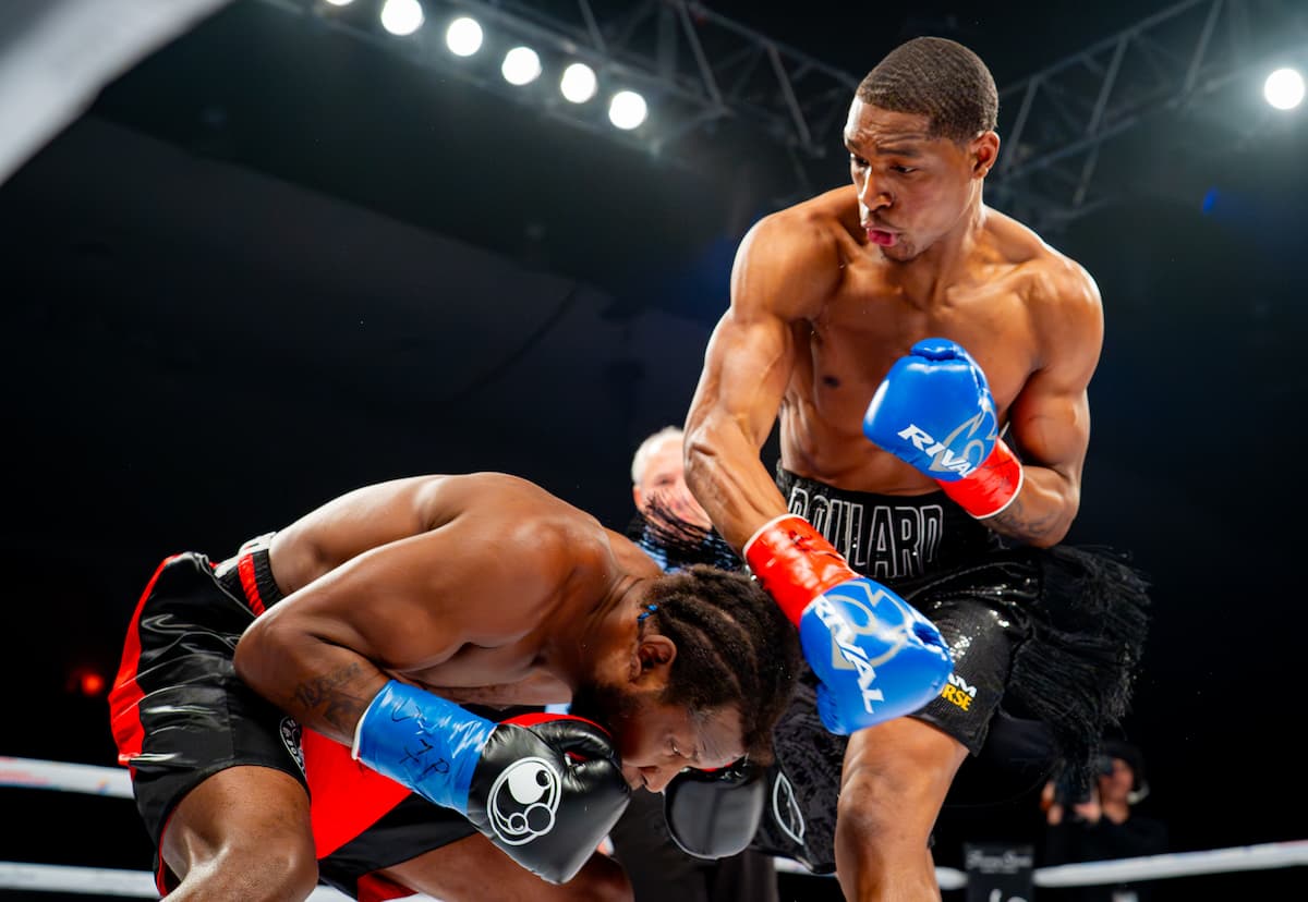 Brandon Poulard dominates Charles Scott Jr during their boxing match
