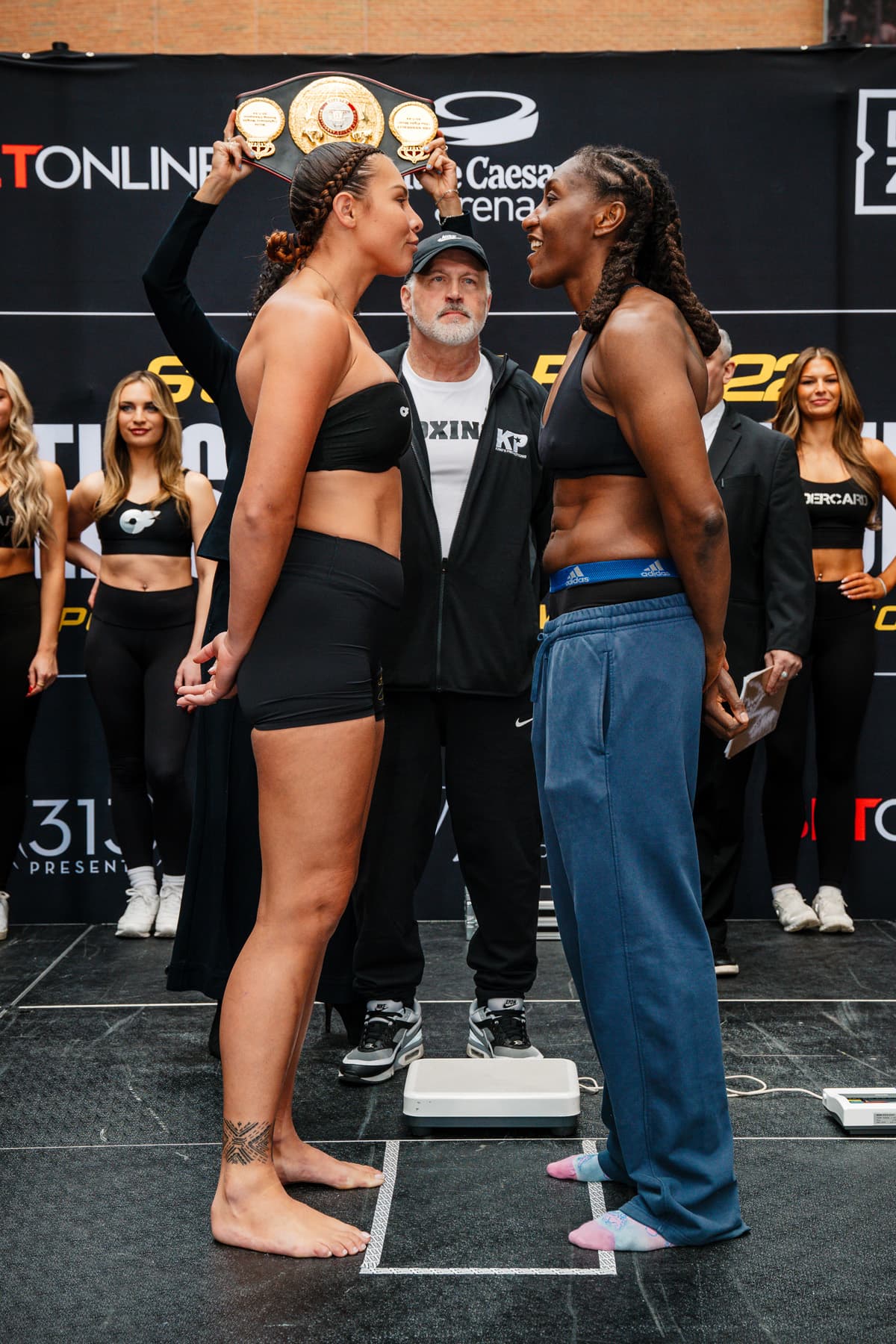 Che Kenneally and Danielle Perkins face off at the weigh-in, ahead of their boxing rematch in Detroit